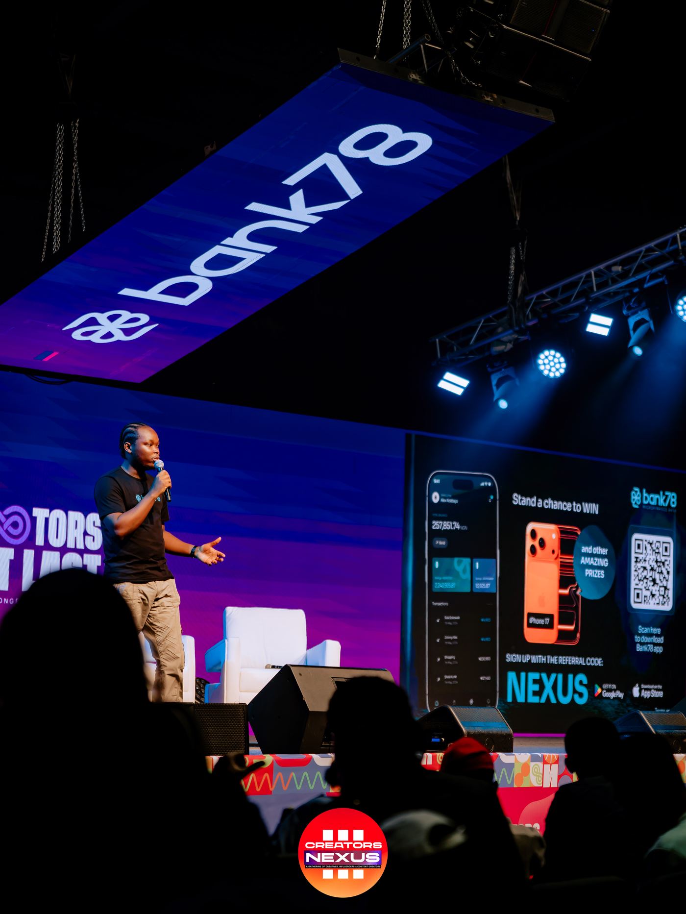 A speaker on the Creators Nexus stage.